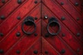 Authentic red wooden front door of an old european house Royalty Free Stock Photo