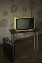 Authentic retro Soviet portable analog TV and attache case, vertical image