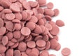 Authentic Ruby Chocolate Drops on a White Background Royalty Free Stock Photo