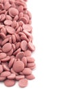 Authentic Ruby Chocolate Drops on a White Background Royalty Free Stock Photo
