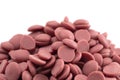 Authentic Ruby Chocolate Drops on a White Background Royalty Free Stock Photo