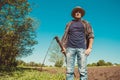 Authentic rural farmer with scythe. Agriculture worker. Farm implements. Rustic background. Work countryside. Hot brutal serious Royalty Free Stock Photo