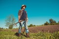 Authentic rural farmer with scythe look at sun. Agriculture worker. Vegetable garden. Farm implements. Rustic background. Brutal Royalty Free Stock Photo