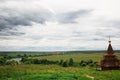 Authentic Russian wooden Church building on a high hill with panoramic views. Royalty Free Stock Photo