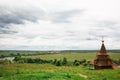 Authentic Russian wooden Church building on a high hill with panoramic views. Royalty Free Stock Photo