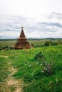 Authentic Russian wooden Church building on a high hill with panoramic views. Royalty Free Stock Photo