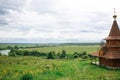 Authentic Russian wooden Church building on a high hill with panoramic views. Royalty Free Stock Photo