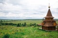 Authentic Russian wooden Church building on a high hill with panoramic views. Royalty Free Stock Photo