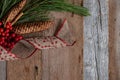 Authentic and rustic Christmas holiday decorations on weathered wood Royalty Free Stock Photo