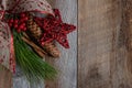 Authentic and rustic Christmas holiday decorations on weathered wood Royalty Free Stock Photo