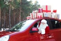 Authentic Santa Claus driving car with gift boxes Royalty Free Stock Photo