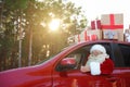 Authentic Santa Claus driving car with gift boxes Royalty Free Stock Photo