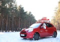 Authentic Santa Claus in red car with gift boxes Royalty Free Stock Photo