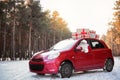 Authentic Santa Claus in red car with gift boxes Royalty Free Stock Photo