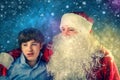 Authentic Santa Claus with a teenager. Royalty Free Stock Photo