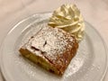 Authentic Traditional Apple Strudel, Apfelstrudel in Vienna, Austria. Served on a white plate, in restaurant setting. Vanilla ice Royalty Free Stock Photo