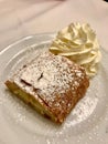 Authentic Traditional Apple Strudel, Apfelstrudel in Vienna, Austria. Served on a white plate, in restaurant setting. Vanilla ice Royalty Free Stock Photo