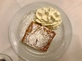 Authentic Traditional Apple Strudel, Apfelstrudel in Vienna, Austria. Served on a white plate, in restaurant setting. Vanilla ice Royalty Free Stock Photo