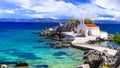 Turquoise sea and traditional white church in Chios island,Greece.