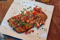 Traditional spanish tapas on a plate. Bruschetta on crusty bread with cheese,tomato,onion and parsley