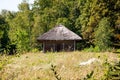 Authentic Ukrainian house in countryside. Summer village in Ukraine. Old folk thatched house. Ukrainian traditional abandoned Royalty Free Stock Photo