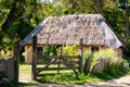 Authentic Ukrainian house in countryside. Summer village in Ukraine. Old folk thatched house. Ukrainian traditional rustic house. Royalty Free Stock Photo