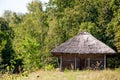 Authentic Ukrainian house in countryside. Summer village in Ukraine. Old folk thatched house. Ukrainian traditional rustic house. Royalty Free Stock Photo