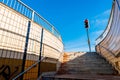 Authentic urban staircase in underground passage with exit to traffic lights in England Royalty Free Stock Photo