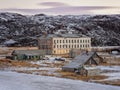 Authentic village of Teriberka in the North of Russia. The building of an old abandoned school against the backdrop of Arctic Royalty Free Stock Photo