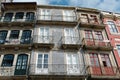 Authentic vintage facades with worn windows and balconies downtown Porto, Portugal