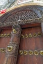 Authentic wooden door close up. Elements of national architecture in Africa.
