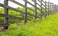 Authentic wooden fence in the village. Handmade wooden fence made of boards. Old fence, rural landscape. Well-trodden path along Royalty Free Stock Photo