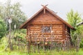 Authentic wooden house with a  pottery vase Royalty Free Stock Photo