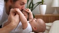 Authentic Young Bearded Man Holding Newborn Baby. Dad And Child Son On Bed. Close-up Portrait of Smiling Family With Royalty Free Stock Photo