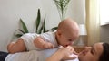 Authentic Young Caucasian Woman Holding Newborn Baby. Mom And Child On Bed. Close-up Portrait of Smiling Family With Royalty Free Stock Photo