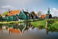 Authentic Zaandam mills and traditional vibrant houses on the water canal in Zaanstad village, Netherlands