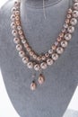 author beautiful jewelry with natural pearls demonstrated around white backround. fashion and jewelry concept