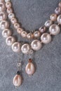 author beautiful jewelry with pearls demonstrated around white backround. fashion and jewelry concept