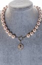 author beautiful pearls necklaces demonstrated on maneken. fashion and jewelry concept