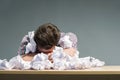 Author lying in the heap of paper Royalty Free Stock Photo