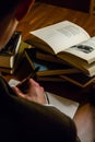 Man reading a writing about a book he is studying