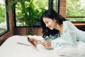 Author, Typewriter, Journalist. Intelligent woman lying on bed a Royalty Free Stock Photo