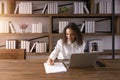 Author working women creative enjoy happy writing new idea on paper. African American black female sitting work journalist at Royalty Free Stock Photo