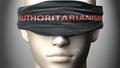 Authoritarianism can make us blind - pictured as word Authoritarianism on a blindfold to symbolize that it can cloud perception,