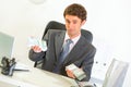 Authoritative businessman sitting at desk