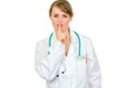 Authoritative doctor woman with finger at mouth
