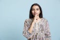 Authoritative woman doing shushing hand gesture in front of camera Royalty Free Stock Photo