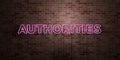 AUTHORITIES - fluorescent Neon tube Sign on brickwork - Front view - 3D rendered royalty free stock picture