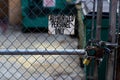 Authorized personnel sign on a chain link fence with dumpsters Royalty Free Stock Photo