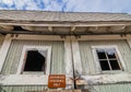 Old rustic abandoned barn with Authorized Personnel Sign on door with broken windows Royalty Free Stock Photo